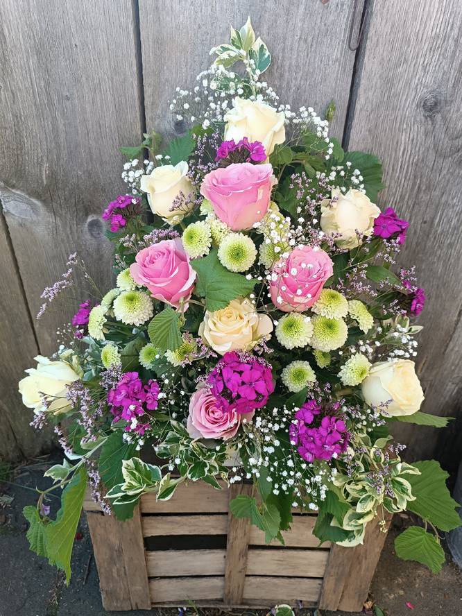 Rouwarrangement roze